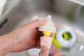 mother hand washing the baby nipple of milk bottle Royalty Free Stock Photo