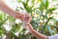 Mother handed the glass to the child. Royalty Free Stock Photo