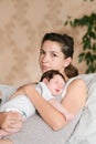 Mother hands. Mother holding head of her newborn son in hands. The baby on hands at mum. Loving mother hand holding cute sleeping