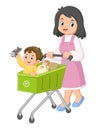 a mother is happily shopping at the supermarket with her son with a shopping cart