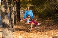 Mother have fun time with kid, use garden wheelbarrow