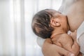 Mother having breast feeding to her infant baby boy Royalty Free Stock Photo