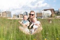 Happy Single Mother With Twin in Nature Park