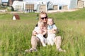 Happy Mother Hugging Her Twin in Nature Park