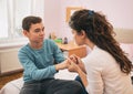 Mother having serious talk with boy at home Royalty Free Stock Photo