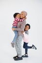 Mother in headscarf posing with her two happy daughters in studio Royalty Free Stock Photo