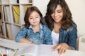 Mother helping child with homework