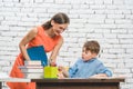 Mother helping her son to do the school homework Royalty Free Stock Photo