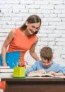 Mother helping her son to do the school homework Royalty Free Stock Photo