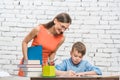 Mother helping her son to do the school homework Royalty Free Stock Photo