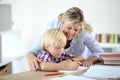 Mother helping his son with homework Royalty Free Stock Photo
