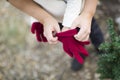 Mother Helping Put Red Mittens On A Child Royalty Free Stock Photo