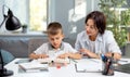 Mother helping son with studying Royalty Free Stock Photo