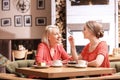 Mother and her adult daughter spending time in cafe Royalty Free Stock Photo