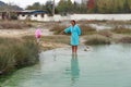 A mother with her baby bathing in the thermal area of Rupite, Bulgaria