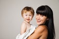 Mother with her baby after bathing in white towel Royalty Free Stock Photo