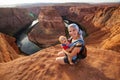 A mother and her baby boy are sitting at the edge Royalty Free Stock Photo