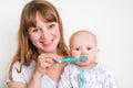 Mother and her baby brushing teeth together Royalty Free Stock Photo