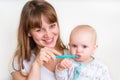 Mother and her baby brushing teeth together Royalty Free Stock Photo