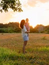 Mother with her baby girl with sunset tones in park