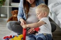 Mother and her baby playing with toy blocks Royalty Free Stock Photo