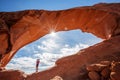 Mother with her baby son stay below Skyline arch in Arches National Park in Utah, USA Royalty Free Stock Photo