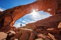 Hiker stay below Skyline arch in Arches National Park in Utah, USA Royalty Free Stock Photo