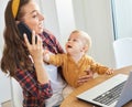 mother baby laptop computer child woman working business mobile phone smartphone parent mom family Royalty Free Stock Photo