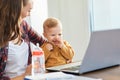 mother baby laptop computer child woman working business parent mom family Royalty Free Stock Photo