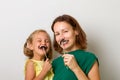 Mother and her child daughter girl with a paper accessories. Royalty Free Stock Photo