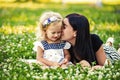 Mother and her child enjoy the early spring, eating apple, happy. Royalty Free Stock Photo