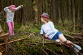 Mother and her child girl playing and having fun together on walk in forest outdoors. Happy loving family posing on nature Royalty Free Stock Photo