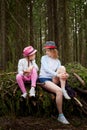 Mother and her child girl playing and having fun together on walk in forest outdoors. Happy loving family posing on nature Royalty Free Stock Photo