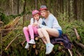 Mother and her child girl playing and having fun together on walk in forest outdoors. Happy loving family posing on nature Royalty Free Stock Photo