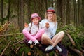 Mother and her child girl playing and having fun together on walk in forest outdoors. Happy loving family posing on nature Royalty Free Stock Photo