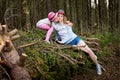 Mother and her child girl playing and having fun together on walk in forest outdoors. Happy loving family posing on nature Royalty Free Stock Photo