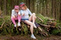 Mother and her child girl playing and having fun together on walk in forest outdoors. Happy loving family posing on nature Royalty Free Stock Photo