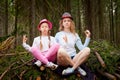 Mother and her child girl playing and having fun together on walk in forest outdoors. Happy loving family posing on nature Royalty Free Stock Photo