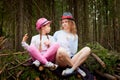 Mother and her child girl playing and having fun together on walk in forest outdoors. Happy loving family posing on nature Royalty Free Stock Photo