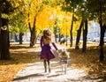 Mother and her child girl playing together on autumn walk in nature outdoors. Royalty Free Stock Photo