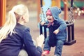 Mother with her child having fun on playground swing Royalty Free Stock Photo