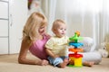 Mother and her child playing with colorful logical Royalty Free Stock Photo