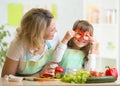 Mother and her child preparing healthy food and Royalty Free Stock Photo