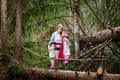 Mother and her child sister girls playing and having fun together on walk in forest outdoors. Happy loving family posing on nature Royalty Free Stock Photo