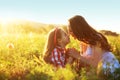 Mother with her child in spring field Royalty Free Stock Photo