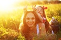 Mother with her child in spring field Royalty Free Stock Photo