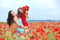 Mother with her child in spring field Royalty Free Stock Photo