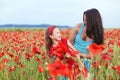 Mother with her child in spring field Royalty Free Stock Photo