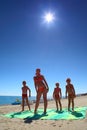 Mother and her children on beach Royalty Free Stock Photo