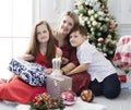 Mother with her children beautiful family with Christmas gifts Royalty Free Stock Photo